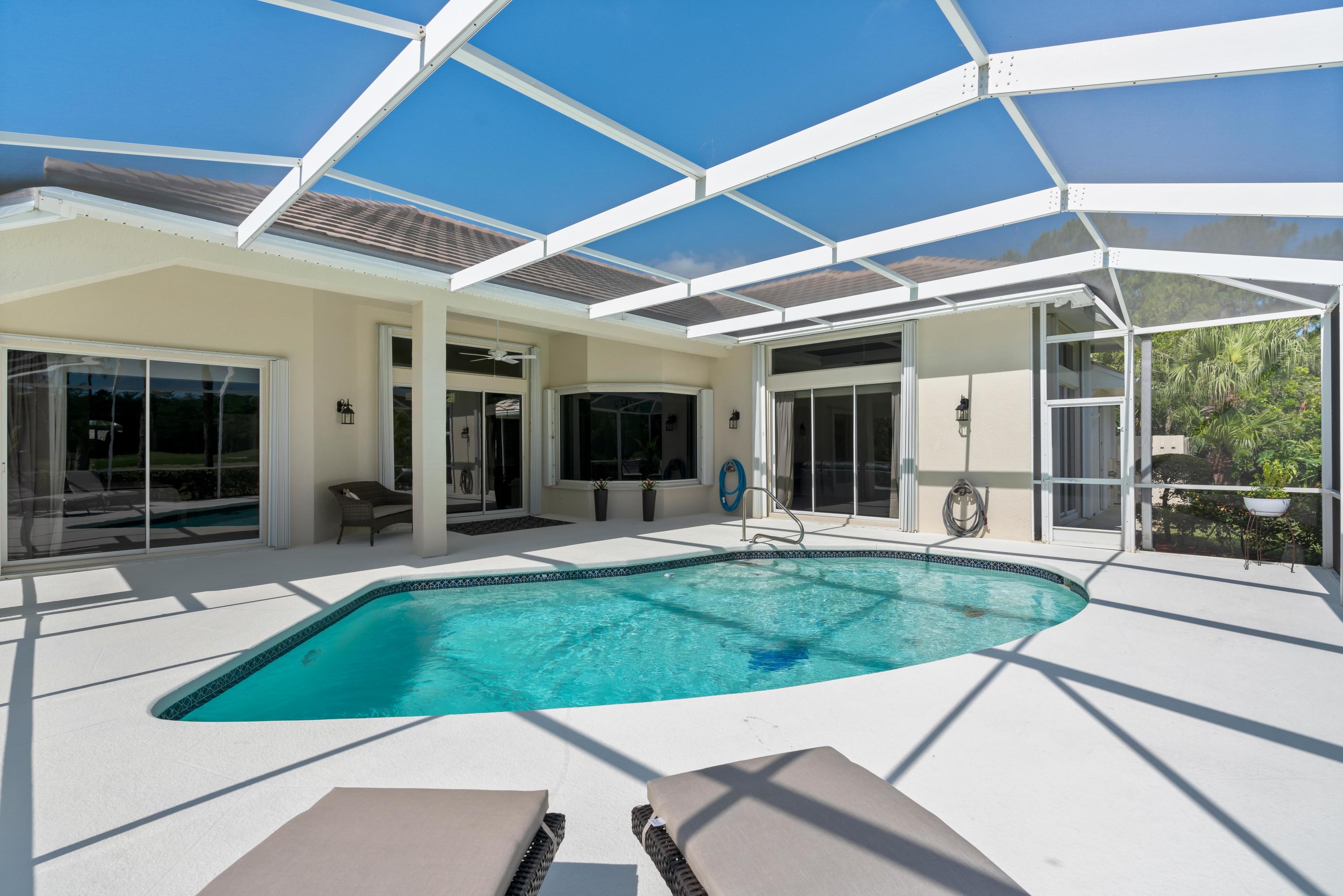 1440 Southeast Colony Way Jupiter, FL 33478 - Photo 49 of 57 Sliding Doors across the Back