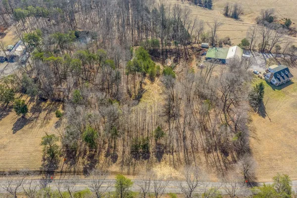 a aerial view of residential houses with trees