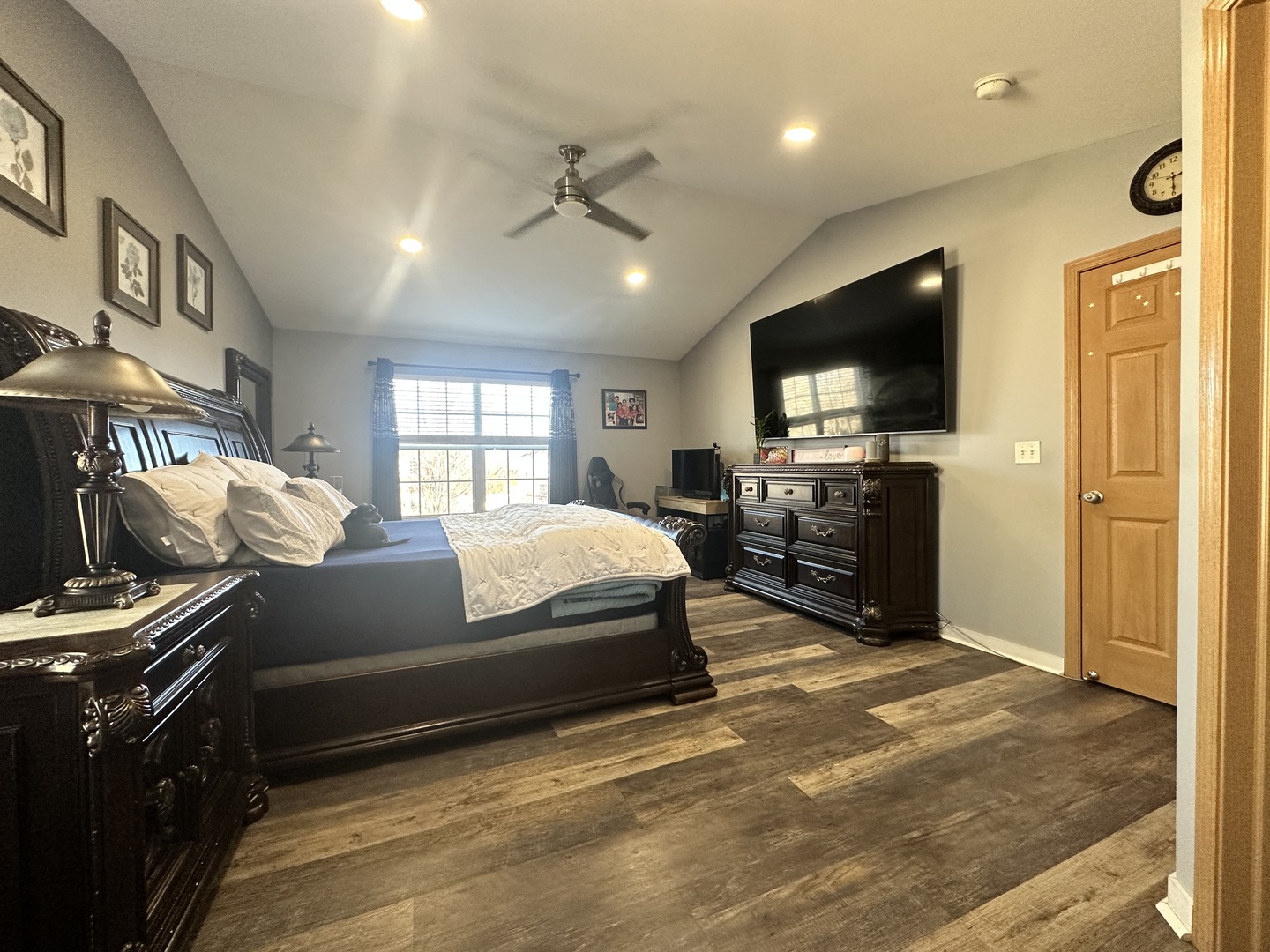 1313 Roth Drive Joliet, IL 60431 - Photo 20 of 22 a spacious bedroom with a bed and a flat screen tv