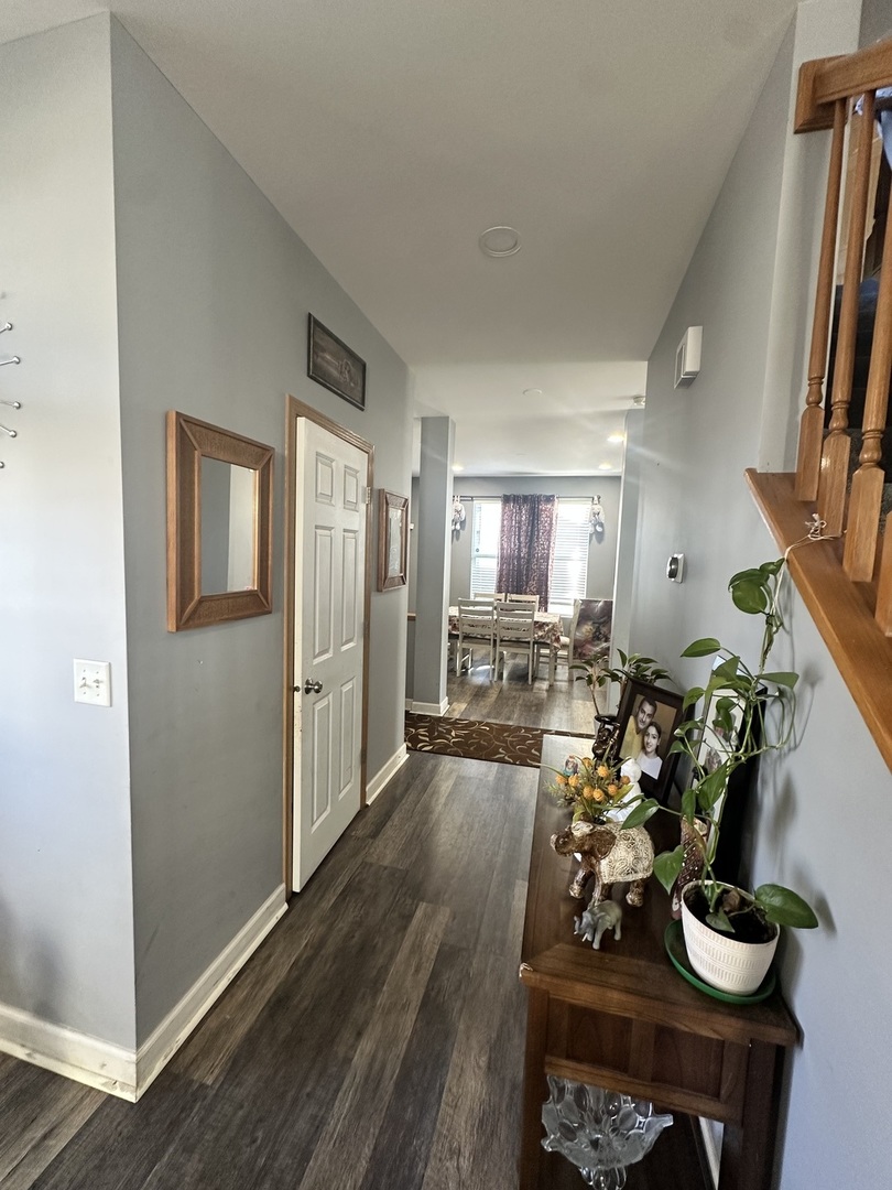 1313 Roth Drive Joliet, IL 60431 - Photo 5 of 22 a living room with furniture and a wooden floor
