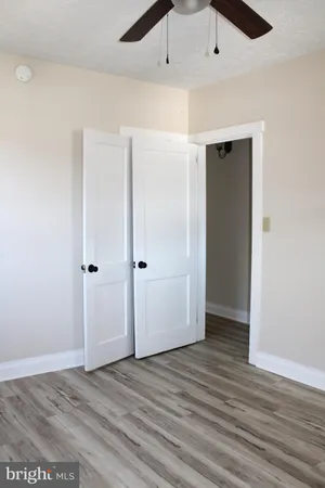 an empty room with wooden floor