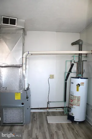 a view of storage and utility room with two washing machine