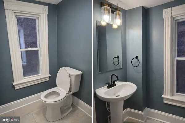 a bathroom with a toilet a sink and mirror