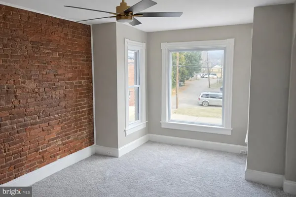 a view of an empty room with a window
