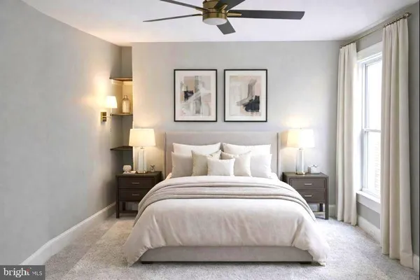 a bedroom with a bed and window