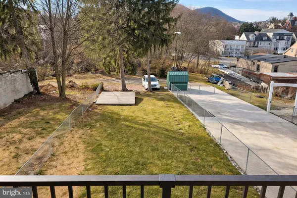 a view of swimming pool from a balcony