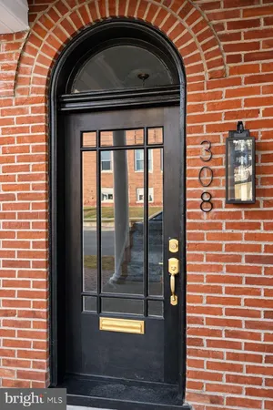 a front view of a house with glass windows
