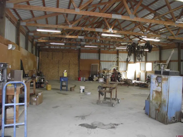 a kitchen with a stove a sink and a refrigerator