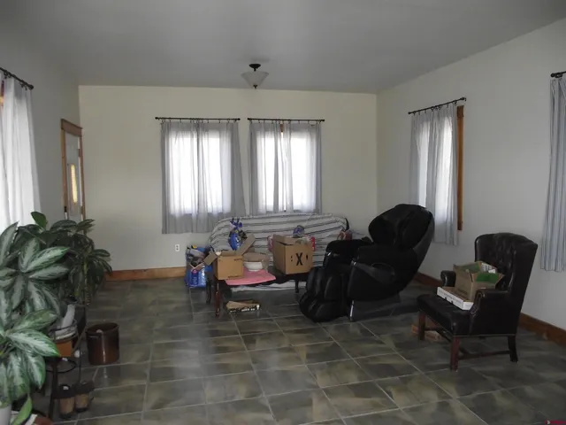 a bedroom with a bed closet and a mirror