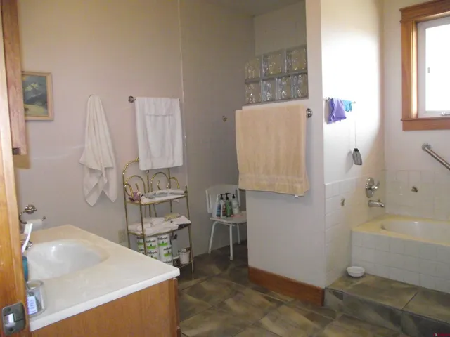 a bedroom with a bed and a mirror