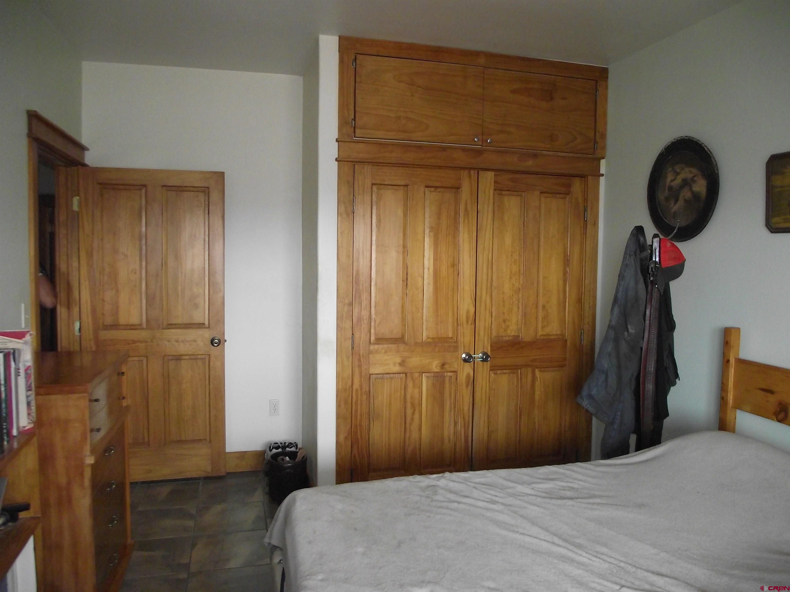 6742 2200th Road Delta, CO 81416 - Photo 31 of 45 a bedroom with a bed and a closet