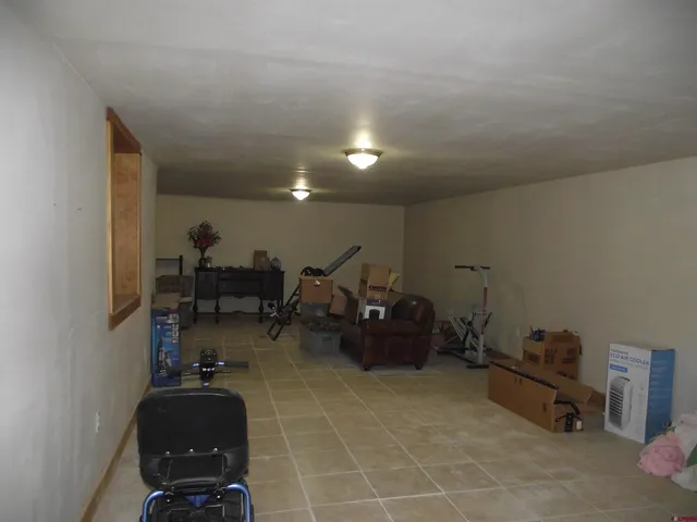 a living room with furniture a dining table and chairs