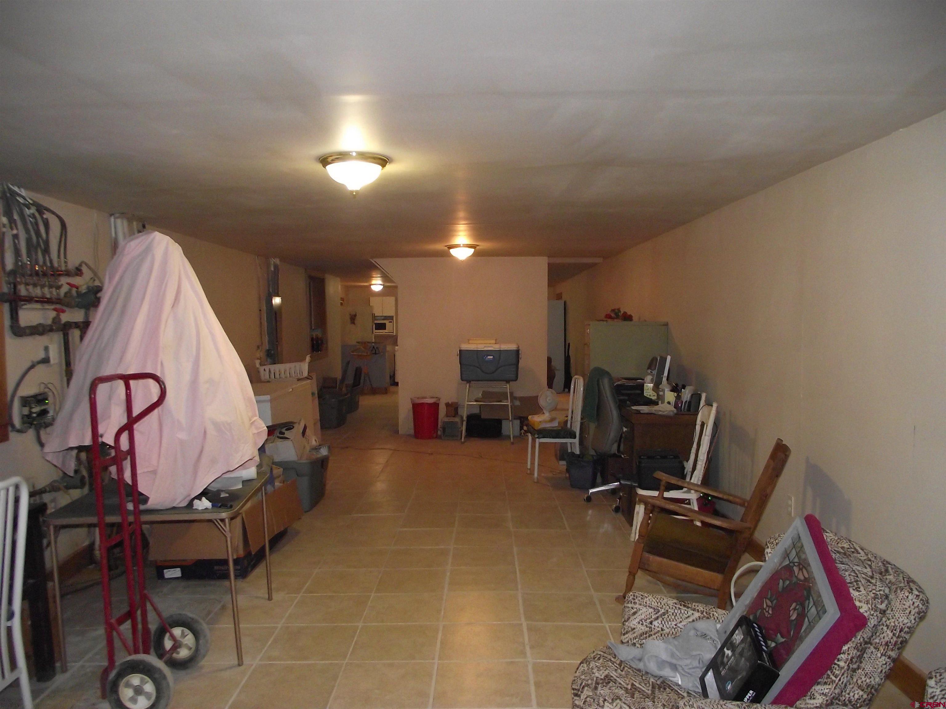 6742 2200th Road Delta, CO 81416 - Photo 38 of 45 a room with gym equipment and a mirror