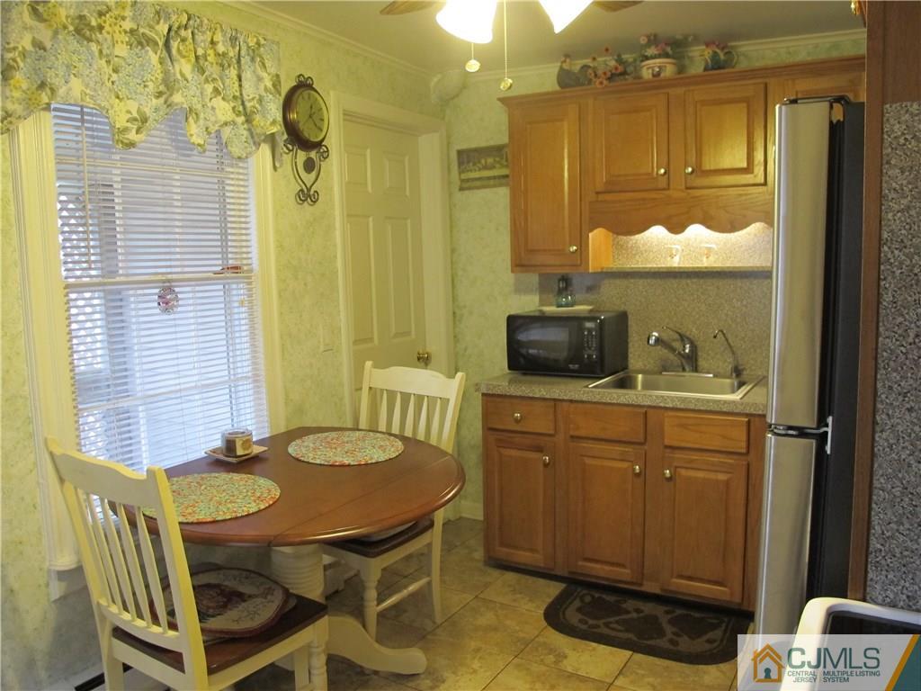 287 Terrill Road Fanwood, NJ 07023 - Photo 8 of 18 a dining room with a table and chairs