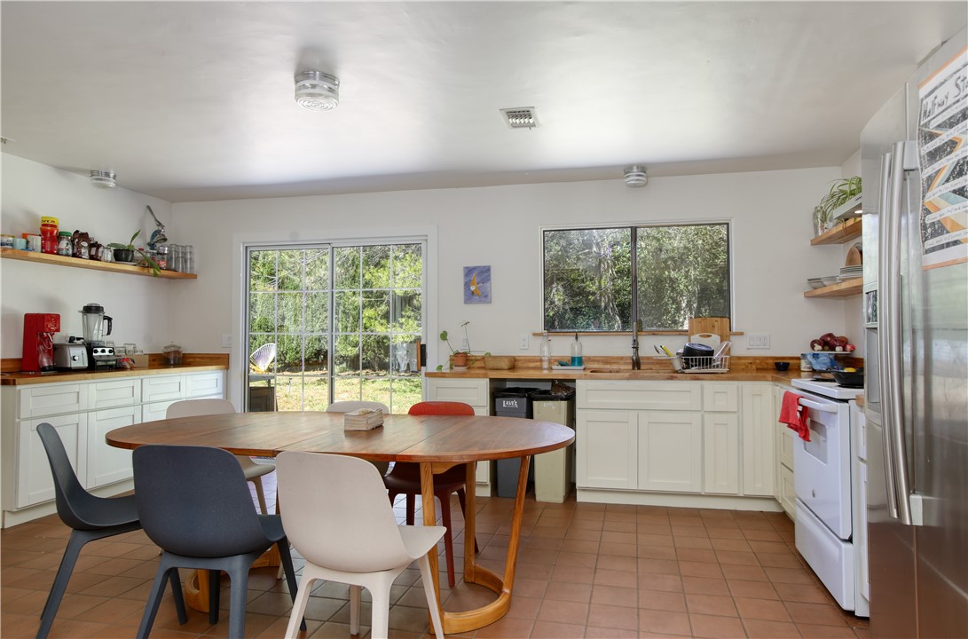 15050 Morro Road Atascadero, CA 93422 - Photo 7 of 33 a kitchen with a dining table and chairs