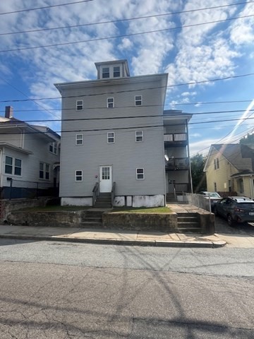 75 Winthrop Street Woonsocket, RI 02895 - Photo 2 of 30 a view of a fireplace