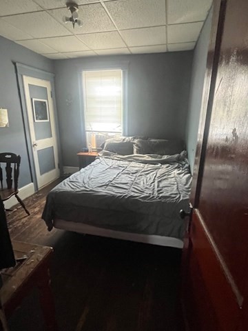 75 Winthrop Street Woonsocket, RI 02895 - Photo 21 of 30 a bedroom with a bed wooden floor and window