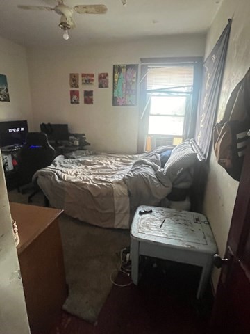 75 Winthrop Street Woonsocket, RI 02895 - Photo 23 of 30 a bedroom with a bed and a window