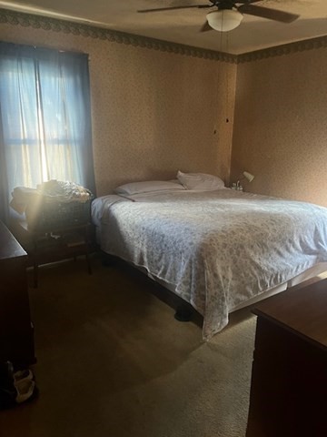 75 Winthrop Street Woonsocket, RI 02895 - Photo 28 of 30 a bedroom with a bed and window