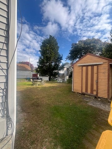 75 Winthrop Street Woonsocket, RI 02895 - Photo 4 of 30 a view of a house with backyard
