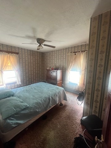 75 Winthrop Street Woonsocket, RI 02895 - Photo 6 of 30 a bedroom with a bed and a window