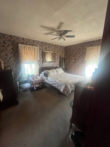 75 Winthrop Street Woonsocket, RI 02895 - Photo 8 of 30 a bedroom with a bed gym equipment and a window