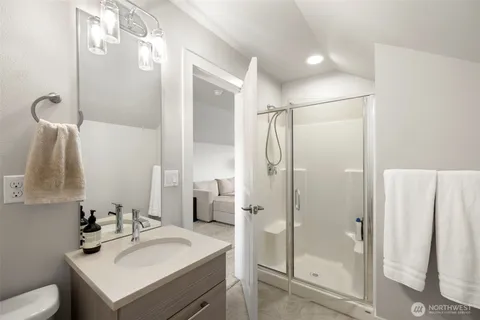 a bathroom with a sink toilet and shower