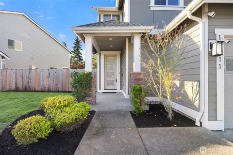 a front view of a house with garden