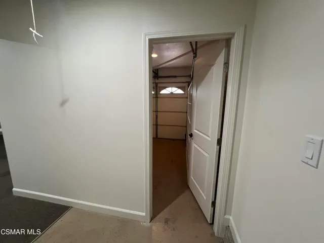 a view of room with wooden floor and window