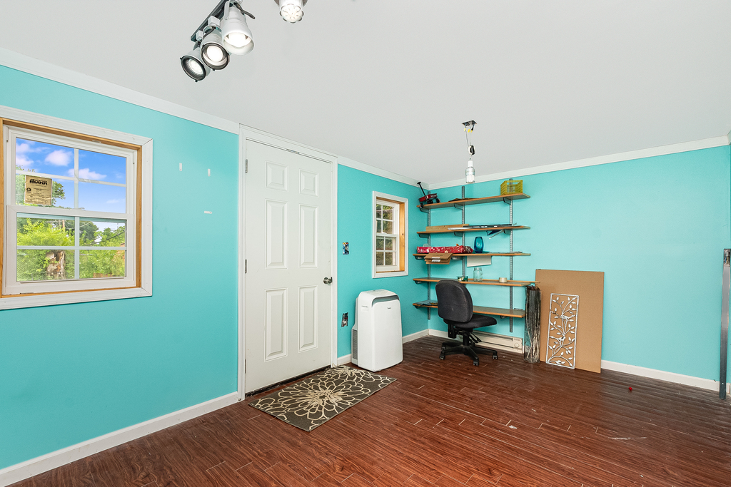 26 Saugatuck Road Montgomery, IL 60538 - Photo 13 of 15 a living room with furniture and a wooden floor