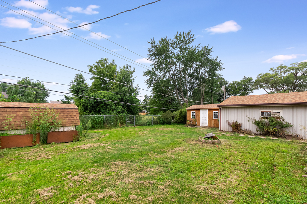 26 Saugatuck Road Montgomery, IL 60538 - Photo 15 of 15 a backyard of a house with plants and outdoor seating