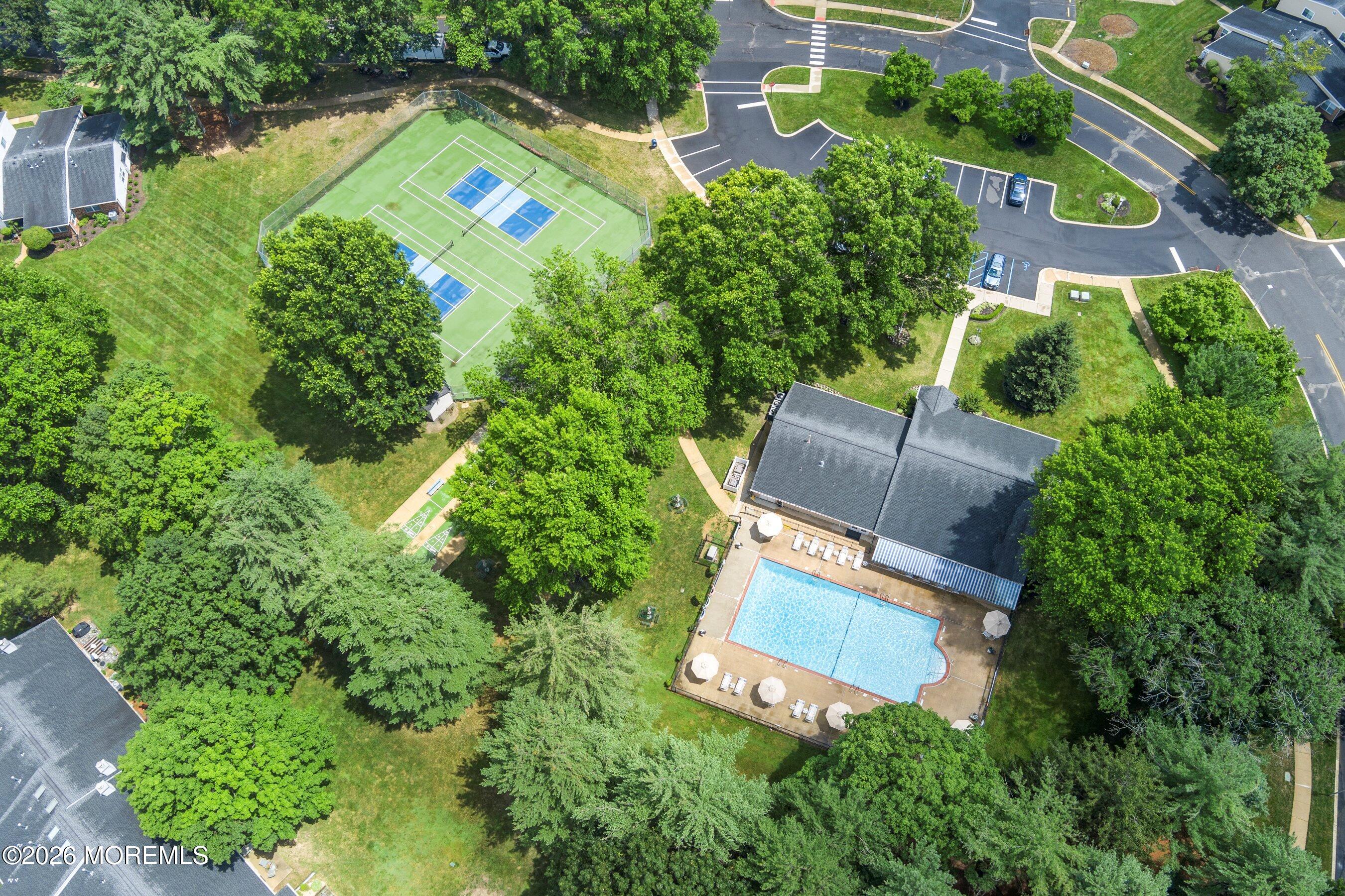 52 Honeysuckle Lane, Unit 220 Red Bank, NJ 07701 - Photo 17 of 25 an aerial view of a house with a yard and swimming pool