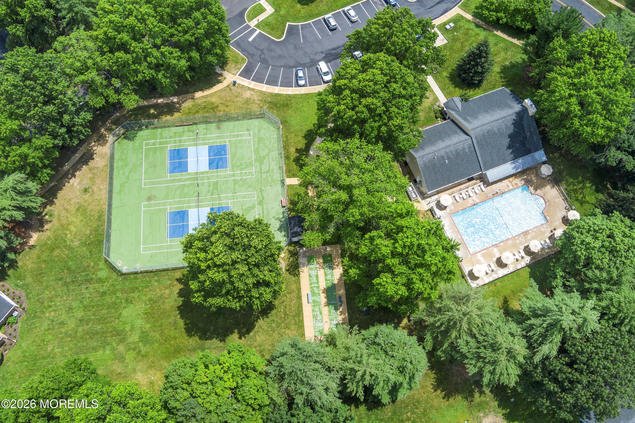 52 Honeysuckle Lane, Unit 220 Red Bank, NJ 07701 - Photo 18 of 25 an aerial view of a house with a yard and garden