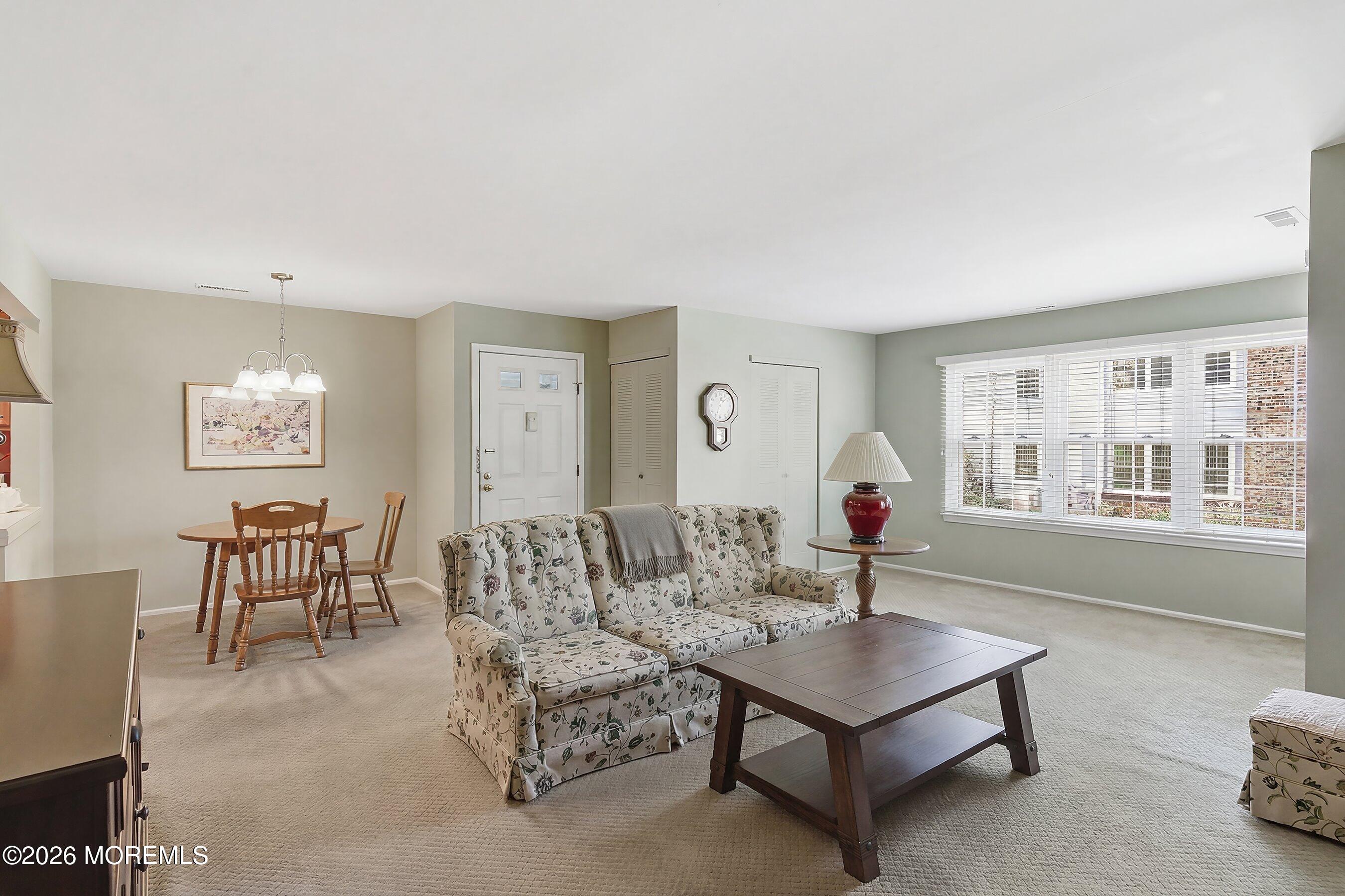 52 Honeysuckle Lane, Unit 220 Red Bank, NJ 07701 - Photo 6 of 25 a living room with furniture and a large window