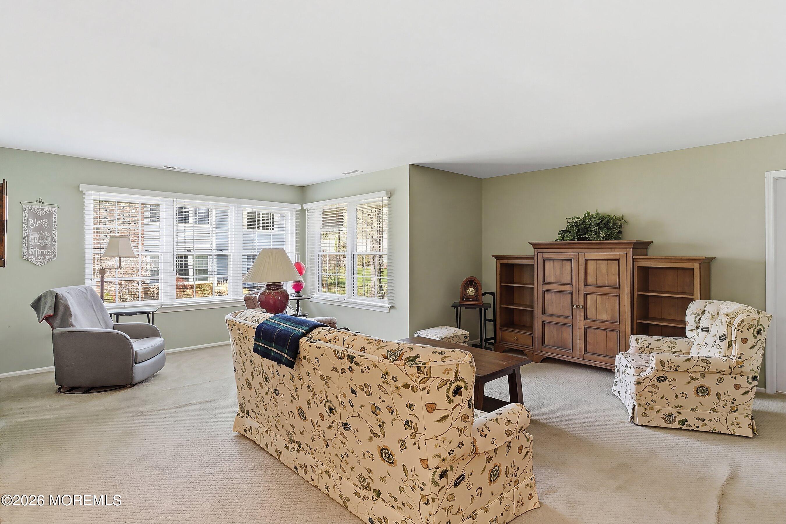 52 Honeysuckle Lane, Unit 220 Red Bank, NJ 07701 - Photo 7 of 25 a living room with furniture and a window