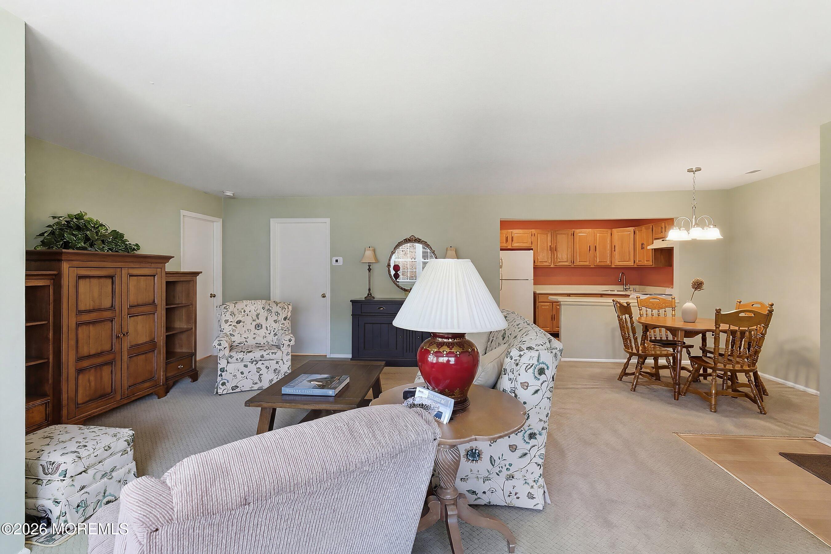 52 Honeysuckle Lane, Unit 220 Red Bank, NJ 07701 - Photo 8 of 25 a living room with furniture and wooden floor