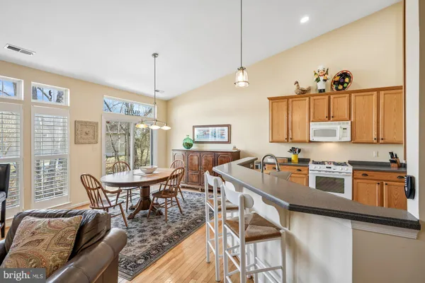 a room with furniture a flat screen tv and a floor to ceiling window