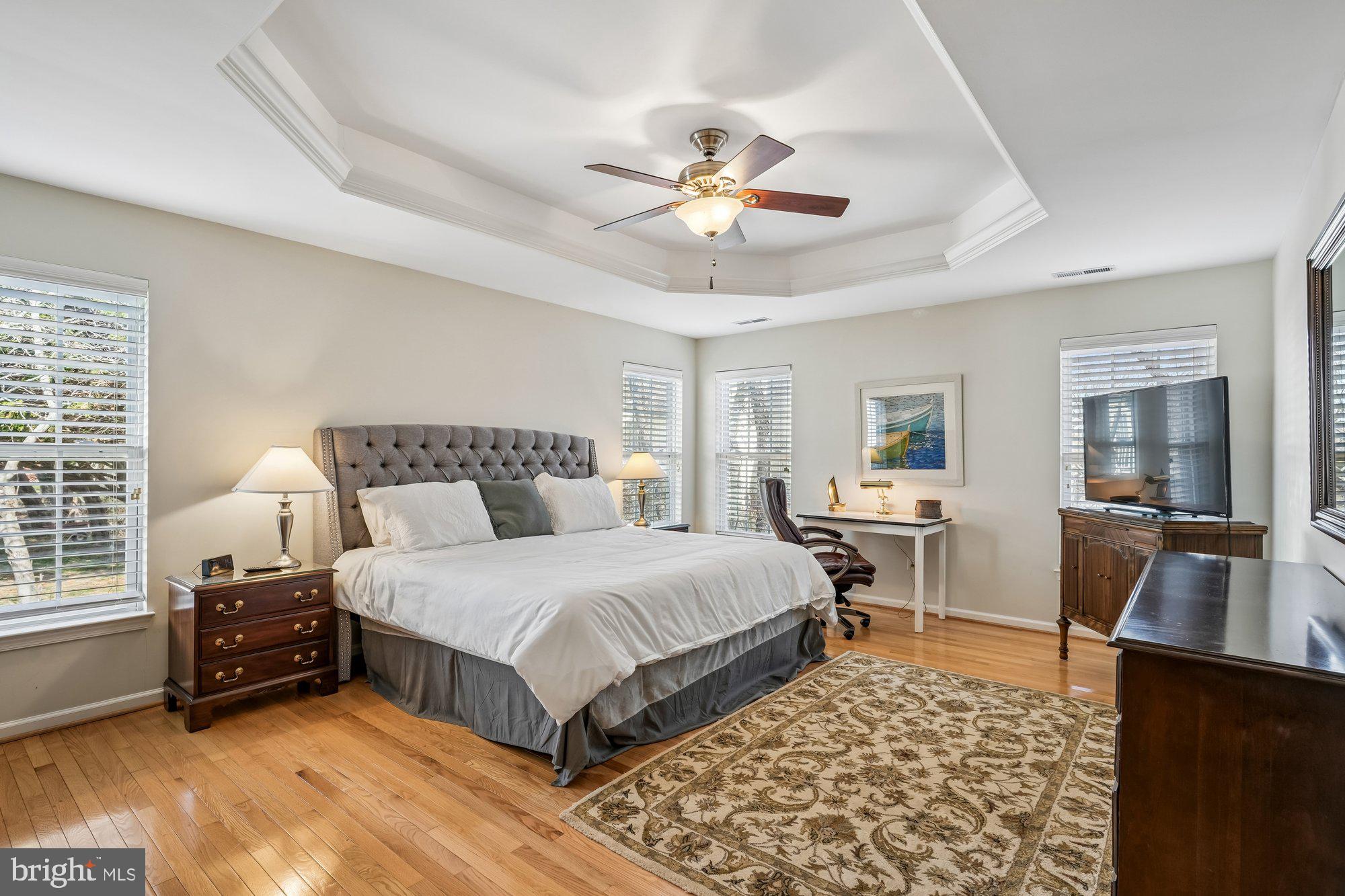 37151 Lord Baltimore Lane Ocean View, DE 19970 - Photo 27 of 68 a spacious bedroom with a bed and a table in it