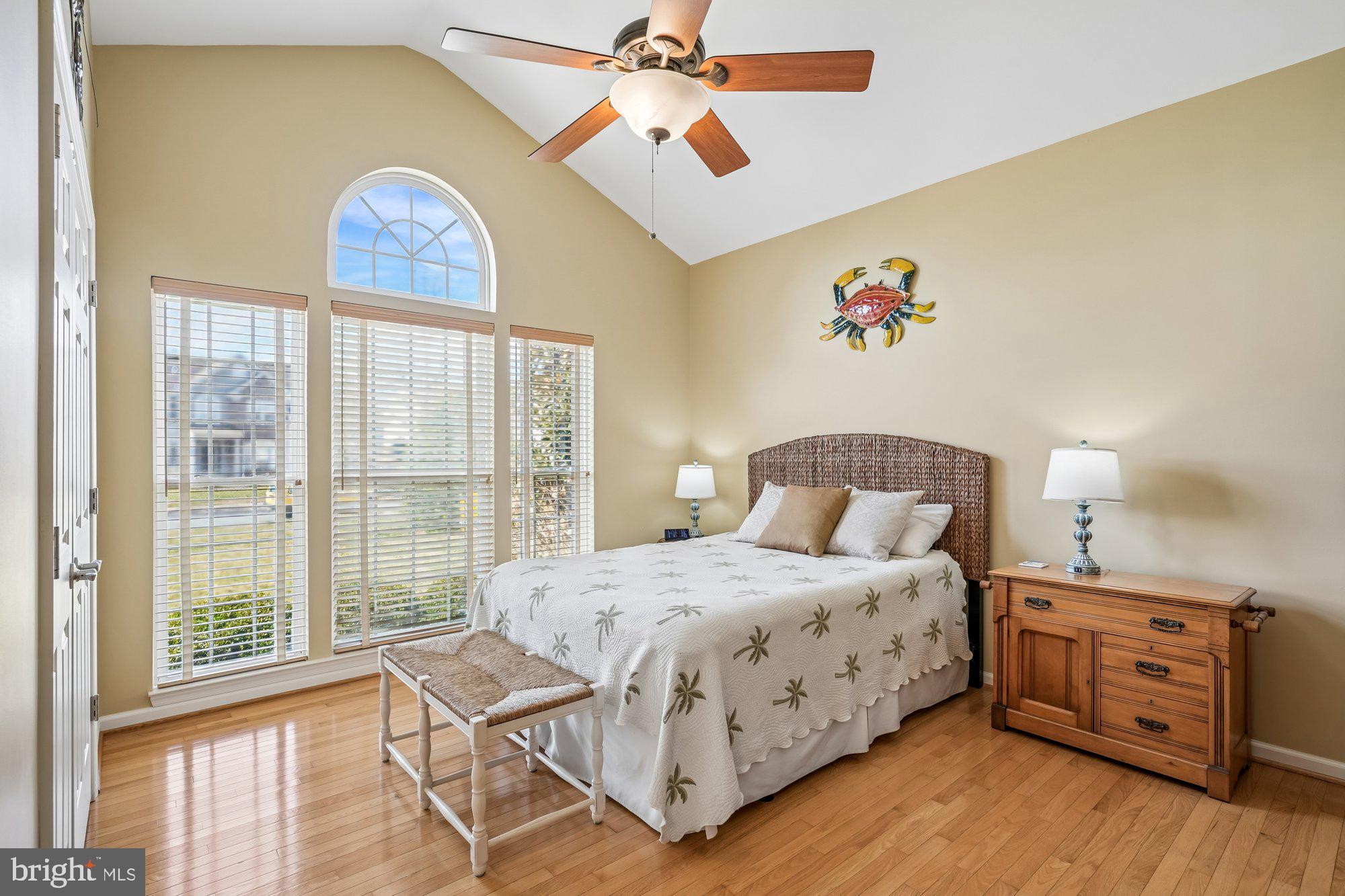37151 Lord Baltimore Lane Ocean View, DE 19970 - Photo 34 of 68 a bedroom with a bed and a chandelier