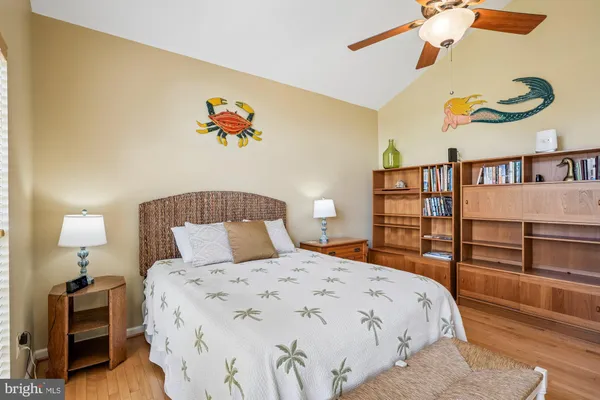 a view of backyard with a table and chairs and potted plants