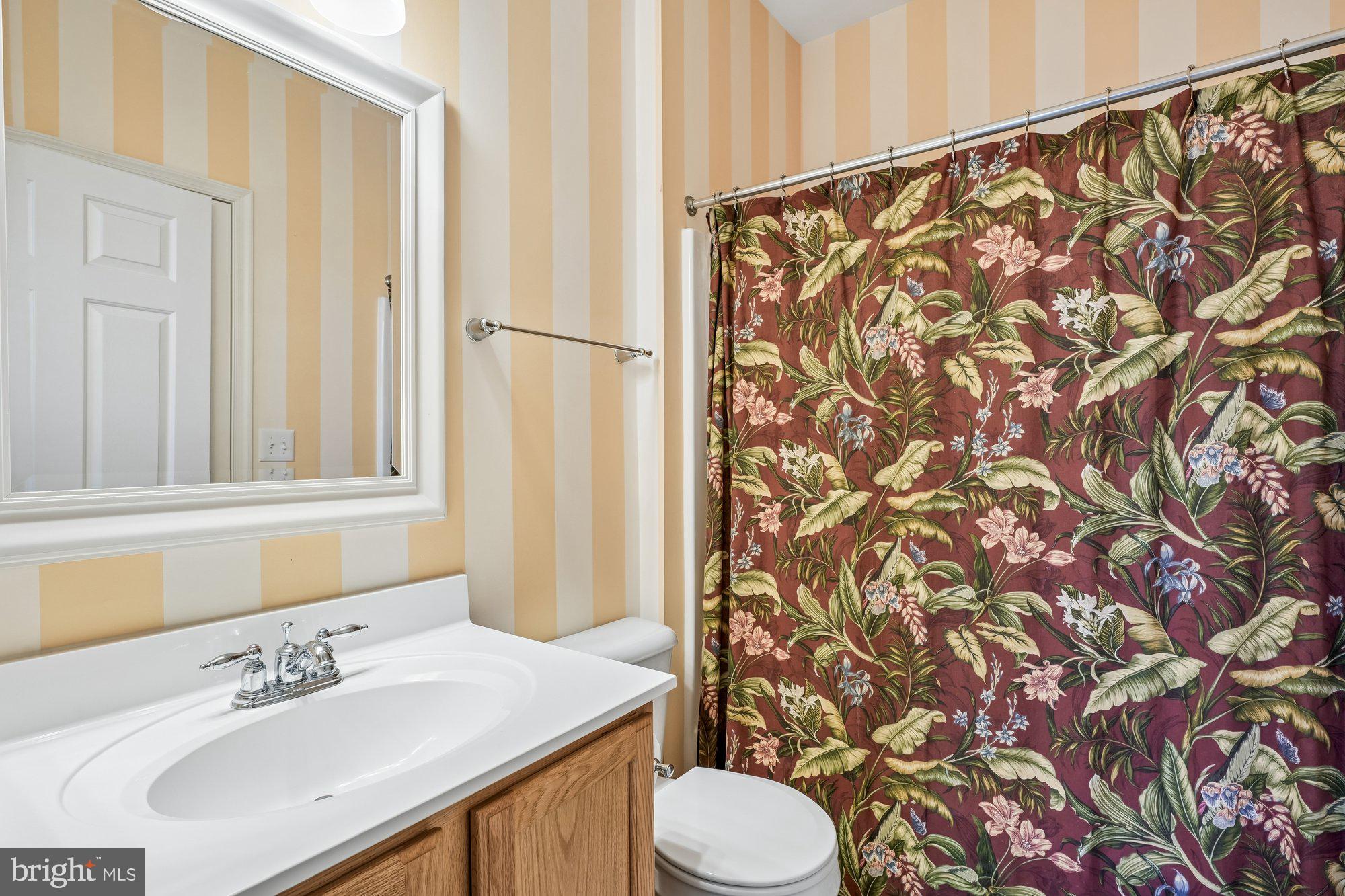 37151 Lord Baltimore Lane Ocean View, DE 19970 - Photo 36 of 68 a bathroom with a sink and a mirror