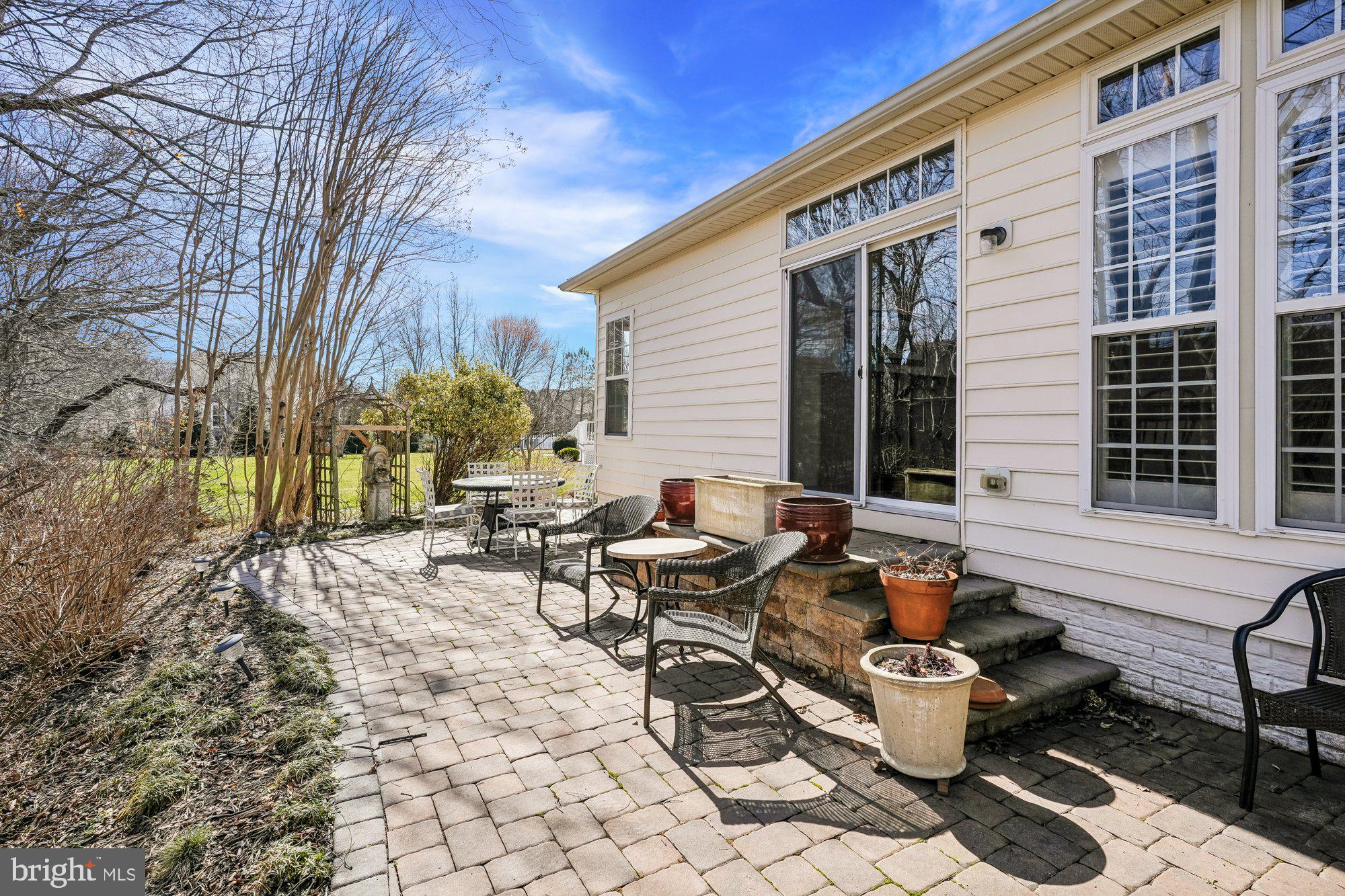 37151 Lord Baltimore Lane Ocean View, DE 19970 - Photo 47 of 68 a view of a patio with chairs and tables