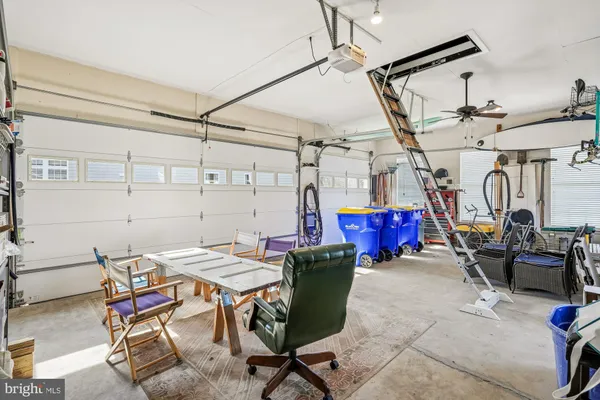 a view of a house with snow on the road