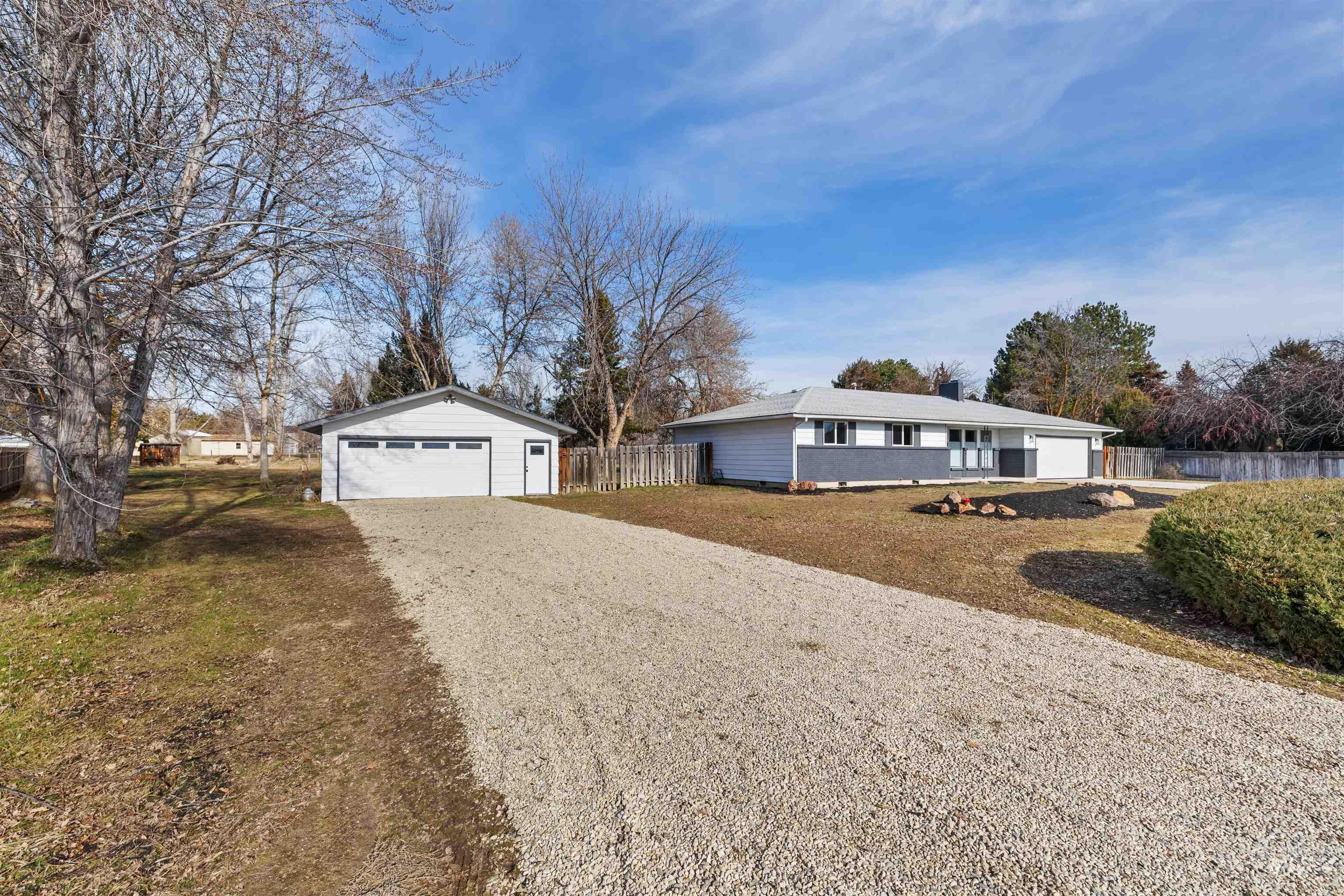 7144 West Diamond Street Boise, ID 83709 - Photo 35 of 47 Single story home with an outdoor structure and a garage