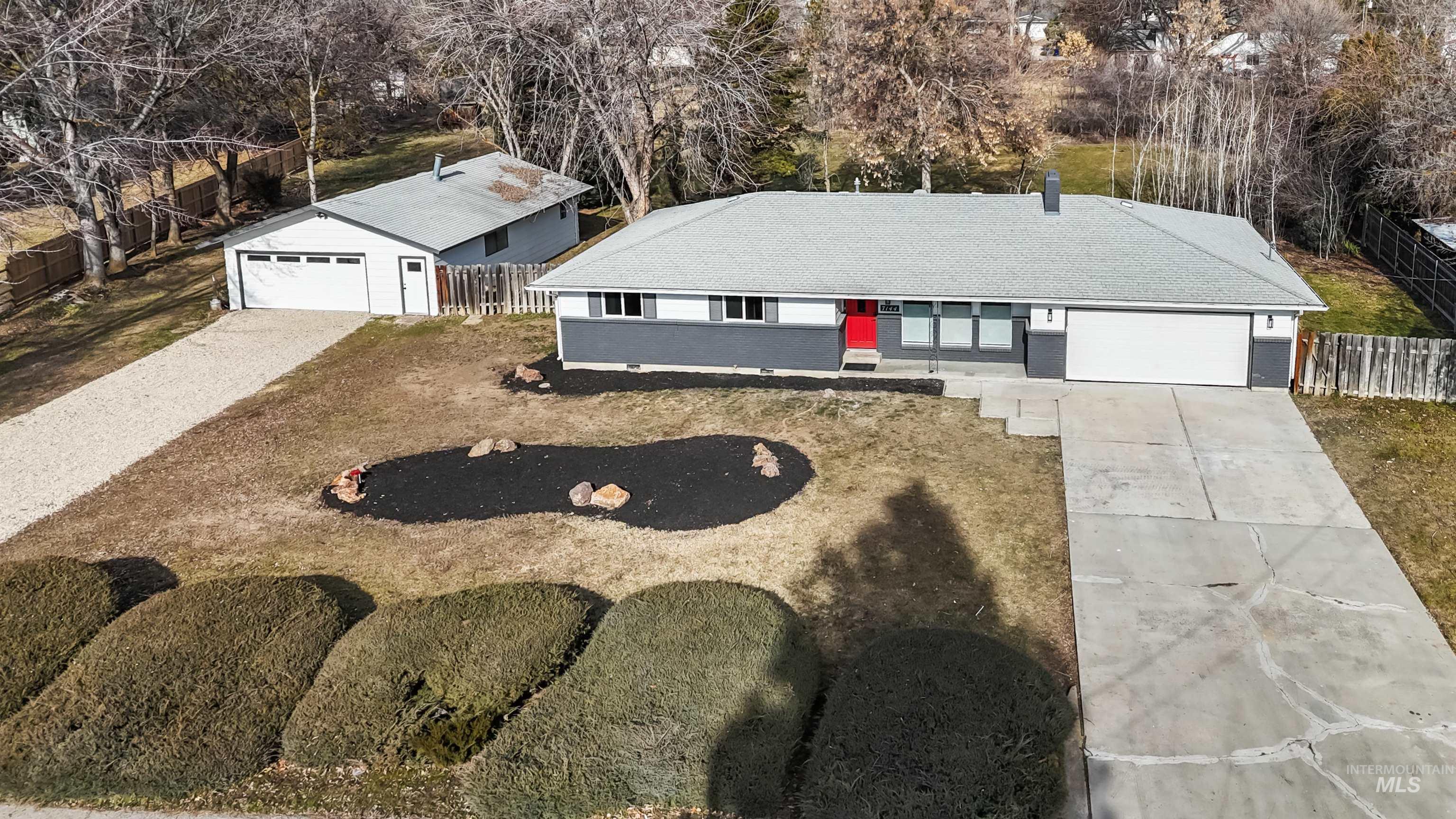 7144 West Diamond Street Boise, ID 83709 - Photo 36 of 47 Aerial view of property and surrounding area with a tree filled landscape