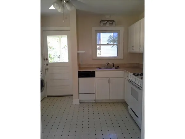 a kitchen with a sink and cabinets