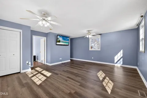 a living room with furniture fireplace and window