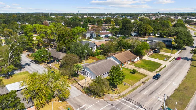 an aerial view of a house with a lake view