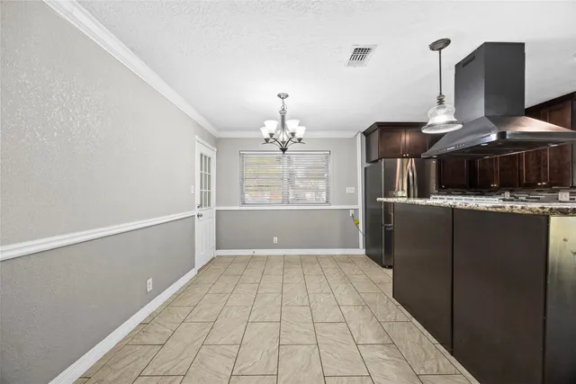 a view of a kitchen with a sink and dishwasher