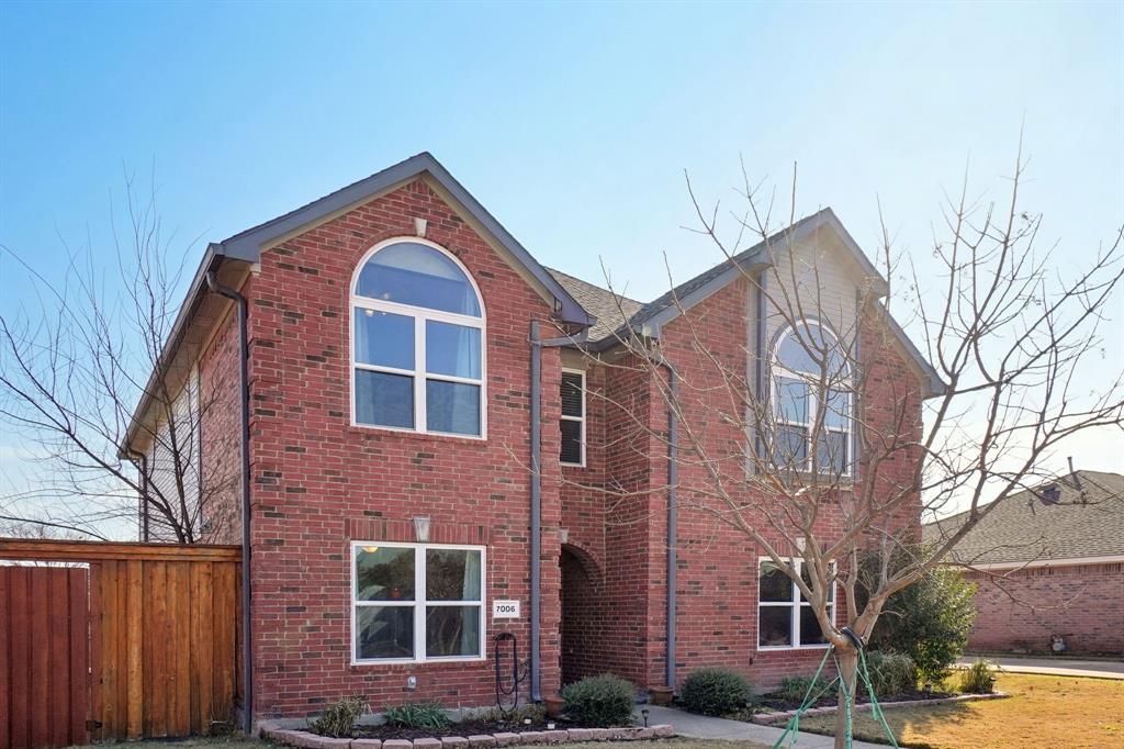 7006 Burning Bush Sachse, TX 75048 - Photo 2 of 39 a front view of a house with a yard